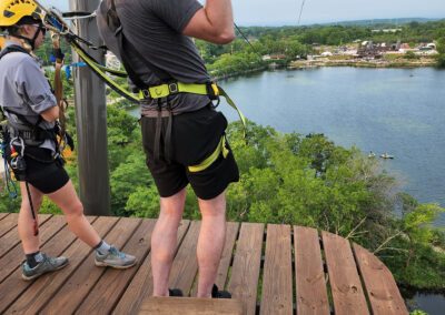 Photo of Sean McCormick giving the thumbs up right before starting a zip line