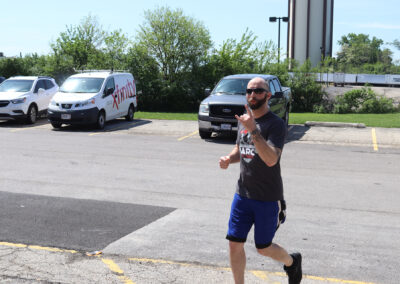 Photo of Sean McCormick running in a parking lot.